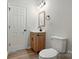 Bathroom featuring modern fixtures, a wood-look vanity, and a stylish light fixture, combining functionality with elegance at 414 Clinton Ave, Lancaster, SC 29720