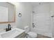 Bathroom with a white vanity, modern fixtures, and a shower-tub combo, creating a clean and functional space at 414 Clinton Ave, Lancaster, SC 29720