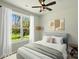 Inviting bedroom featuring a comfortable bed, stylish decor, and a window with sheer curtains, creating a serene retreat at 414 Clinton Ave, Lancaster, SC 29720