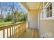 View of a home's cozy wooden deck and railing with outdoor scenery at 414 Clinton Ave, Lancaster, SC 29720