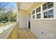 View of a home's cozy wooden deck and railing with outdoor scenery at 414 Clinton Ave, Lancaster, SC 29720