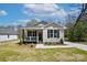 Inviting home with covered porch, black shutters, and manicured landscaping at 414 Clinton Ave, Lancaster, SC 29720