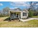 Charming home featuring black shutters, a cozy front porch and well-maintained landscaping at 414 Clinton Ave, Lancaster, SC 29720