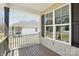 This charming front porch features wood floors, white trim, and a beautiful view at 414 Clinton Ave, Lancaster, SC 29720
