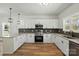 Updated kitchen featuring granite countertops, stainless steel appliances, and ample cabinet space at 414 Clinton Ave, Lancaster, SC 29720