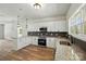 Fully equipped kitchen featuring granite countertops, stainless appliances, and a modern design at 414 Clinton Ave, Lancaster, SC 29720