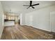 An open-concept living space featuring vinyl wood floors and modern lighting fixtures at 414 Clinton Ave, Lancaster, SC 29720
