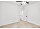 Carpeted bedroom with white walls, a ceiling fan, and an ensuite bath at 602 Meadow Ave, Spencer, NC 28159