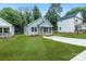 Quaint single-story home has a light exterior, a compact porch, and a freshly cut front lawn at 602 Meadow Ave, Spencer, NC 28159