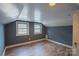 Bedroom with two windows and wood-look floors at 1129 Rita Ave, Statesville, NC 28677