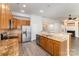 Spacious kitchen with stainless steel appliances, granite countertops, and hardwood floors at 8511 Castledown Dr, Huntersville, NC 28078