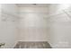 Spacious walk-in closet with carpet and ample shelving at 8511 Castledown Dr, Huntersville, NC 28078