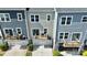 Rear view of townhouses with decks and garages at 11712 Blessington Rd, Huntersville, NC 28078