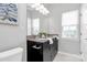 Double vanity bathroom with granite countertop and dark brown cabinets at 11712 Blessington Rd, Huntersville, NC 28078