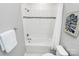 Clean bathroom with white tile, shower, and tub at 11712 Blessington Rd, Huntersville, NC 28078