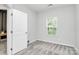 Simple bedroom with carpeted floor and window with blinds at 11712 Blessington Rd, Huntersville, NC 28078