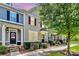Modern townhome with gray siding, stone accents, and landscaped front yard at 11712 Blessington Rd, Huntersville, NC 28078