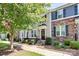 Front of townhome showcasing architectural details and landscaping at 11712 Blessington Rd, Huntersville, NC 28078