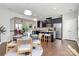 Open concept kitchen with island, dark cabinetry, and stainless steel appliances at 11712 Blessington Rd, Huntersville, NC 28078