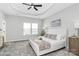 Spacious main bedroom with carpeted floor, ceiling fan, and large bed at 11712 Blessington Rd, Huntersville, NC 28078