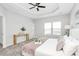 Main bedroom with carpeted floor, ceiling fan, and a large bed at 11712 Blessington Rd, Huntersville, NC 28078