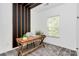 Home office with wood desk, window, and stylish wall decor at 11712 Blessington Rd, Huntersville, NC 28078