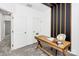 Home office featuring a wooden desk and a modern wall design at 11712 Blessington Rd, Huntersville, NC 28078