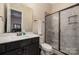 This bathroom features a vanity sink and glass enclosed shower at 16827 Monocacy Blvd, Huntersville, NC 28078