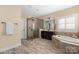 This bathroom features double vanities, walk-in shower and soaking tub at 16827 Monocacy Blvd, Huntersville, NC 28078