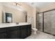 Bathroom featuring vanity with countertop, and walk-in shower with glass doors at 16827 Monocacy Blvd, Huntersville, NC 28078