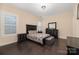 This bedroom features hardwood floors, large window and furnishings at 16827 Monocacy Blvd, Huntersville, NC 28078