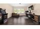 Bonus room featuring dark floors, an arcade game, a seating area, and a desk with a computer at 16827 Monocacy Blvd, Huntersville, NC 28078