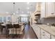 Modern kitchen featuring granite countertops, stainless steel appliances, breakfast bar, and ample cabinet space at 16827 Monocacy Blvd, Huntersville, NC 28078