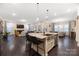 Open kitchen layout with island, bar stool seating, and stainless steel appliances, perfect for entertaining at 16827 Monocacy Blvd, Huntersville, NC 28078