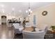 Comfortable living area open to kitchen, with plush seating and view of island with barstools at 16827 Monocacy Blvd, Huntersville, NC 28078
