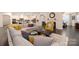 Spacious living room featuring a comfortable sectional, hardwood floors, and abundant natural light at 16827 Monocacy Blvd, Huntersville, NC 28078