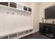 Mudroom has shelving, storage and coat hooks with seating at 16827 Monocacy Blvd, Huntersville, NC 28078