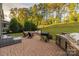 Outdoor patio with a grilling area, built-in seating around a fire pit, and lounge furniture at 16827 Monocacy Blvd, Huntersville, NC 28078
