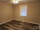 Simple bedroom with wood-look flooring and window at 4695 Ramsey Rd, Sharon, SC 29742