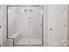 Modern bathroom featuring glass-enclosed shower with bench and tiled walls at 552 Fern Hill Rd # 21, Mooresville, NC 28117