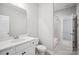Bathroom features a sink with white cabinets, neutral walls, and a toilet at 552 Fern Hill Rd # 21, Mooresville, NC 28117