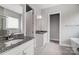 Bathroom showcases granite countertops, dual sinks, a soaking tub, and tiled floors at 552 Fern Hill Rd # 21, Mooresville, NC 28117