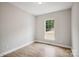 Bedroom features wood-look floors and a large window providing ample natural light at 552 Fern Hill Rd # 21, Mooresville, NC 28117