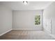 Neutral-colored bedroom with carpet flooring and a single window at 552 Fern Hill Rd # 21, Mooresville, NC 28117