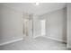 Neutral colored bedroom featuring neutral carpet and three doorways at 552 Fern Hill Rd # 21, Mooresville, NC 28117