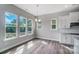 Bright dining area featuring wood floors, neutral walls, and lots of natural light at 552 Fern Hill Rd # 21, Mooresville, NC 28117