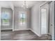 Inviting entryway featuring luxury vinyl plank flooring and stylish lighting fixture at 552 Fern Hill Rd # 21, Mooresville, NC 28117