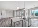 Kitchen island featuring granite countertops and a stainless steel sink at 552 Fern Hill Rd # 21, Mooresville, NC 28117
