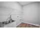 Functional laundry room with a sink, storage, and hookups at 552 Fern Hill Rd # 21, Mooresville, NC 28117