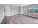 Bright, airy living room with large windows and a neutral color scheme overlooking a backyard deck at 552 Fern Hill Rd # 21, Mooresville, NC 28117
